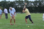 Man holding croquet mallet pretending to hit his opponent while he takes his shot at Croquet on the Green 2019