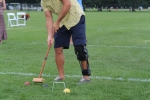 Man taking a shot at croquet at Croquet on the Green 2019