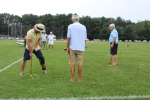 Man takes a backwards shot of croquet through his own legs at Croquet on the Green 2019