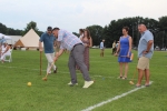 Man hitting croquet ball as a group of people watch on at Croquet on the Green 2019