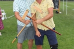 Two men holding croquet mallets in an X shape at Croquet on the Green 2019