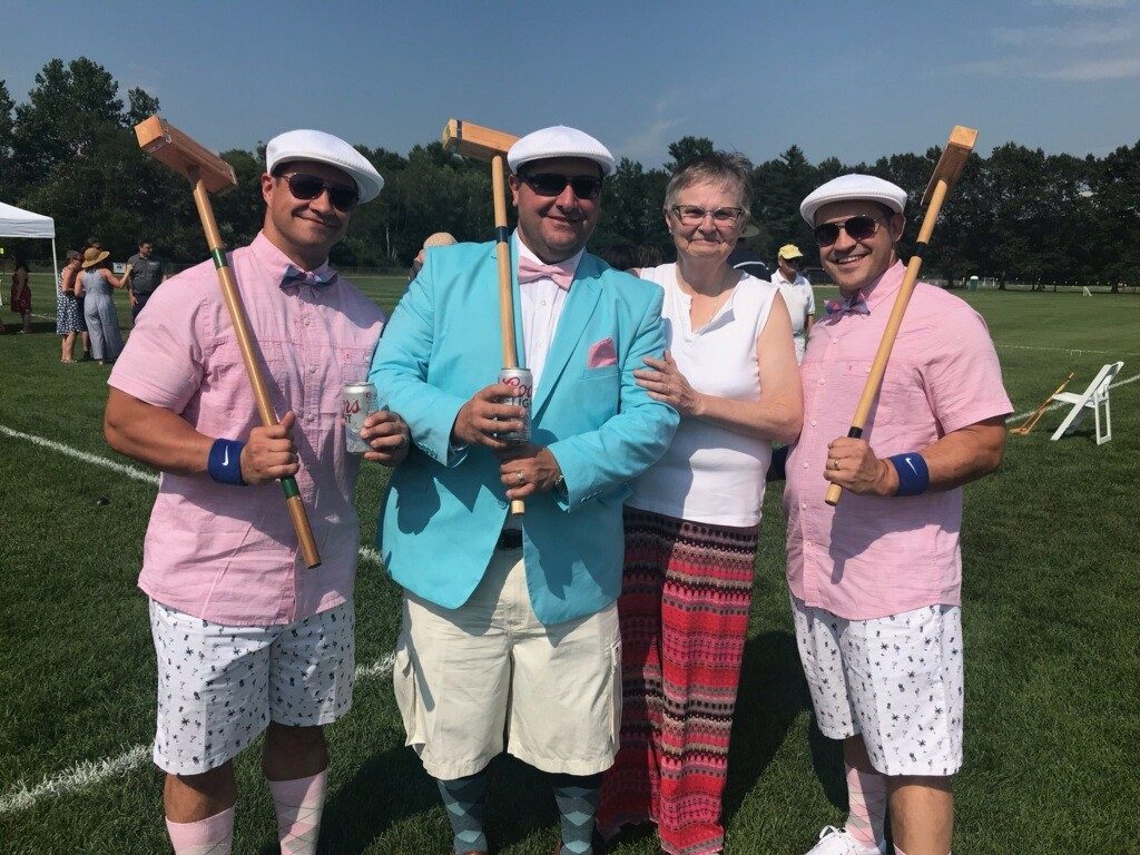 June MacClelland and group of three men dressed up with croquet mallets at Croquet on the Green 2019