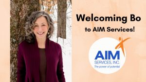 Photo of Bo Goliber with orange background text that says "Welcoming Bo to AIM Services!" and AIM logo
