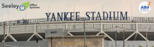 Yankee Stadium sign with Seeley Office Systems logo