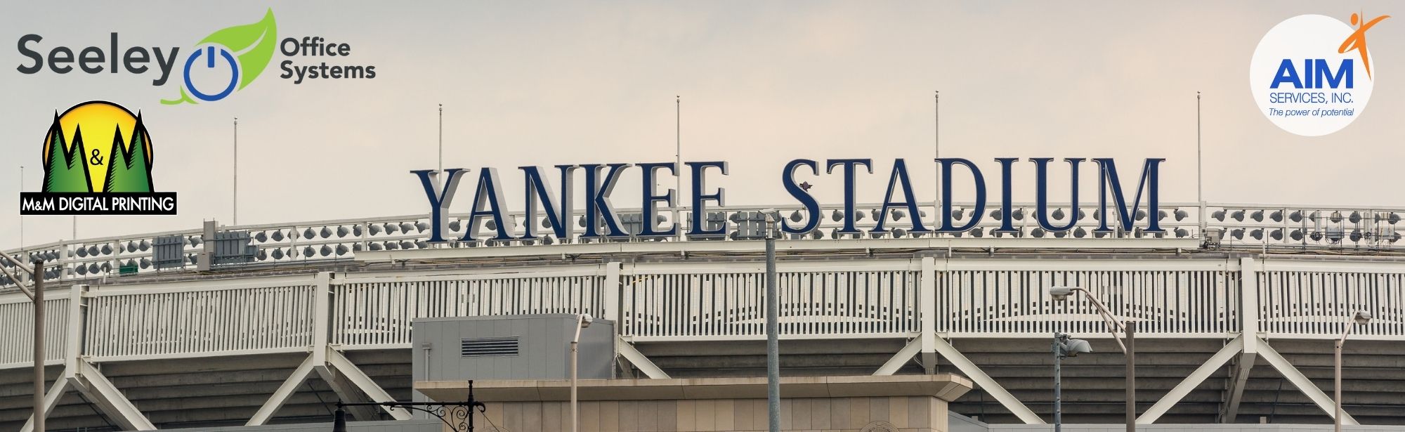 yankee stadium entrance picture with seeley office, M&M Printing and AIM Services logo