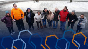 people standing arm in arm with navy color and hexagon shapes on the bottom